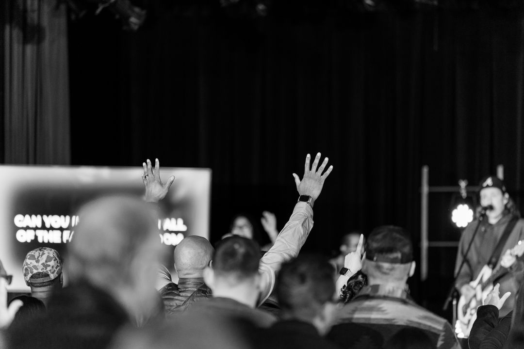 Hands holding an open Bible